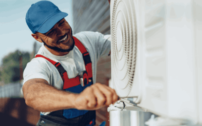 A man repairing an AC unit.